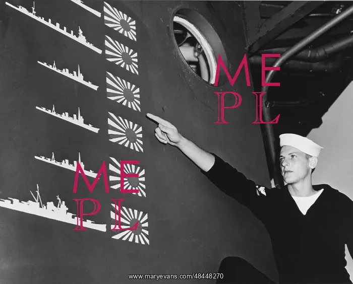 : USS Boise sailor points out details of the : USS Boise sailor points out details of the