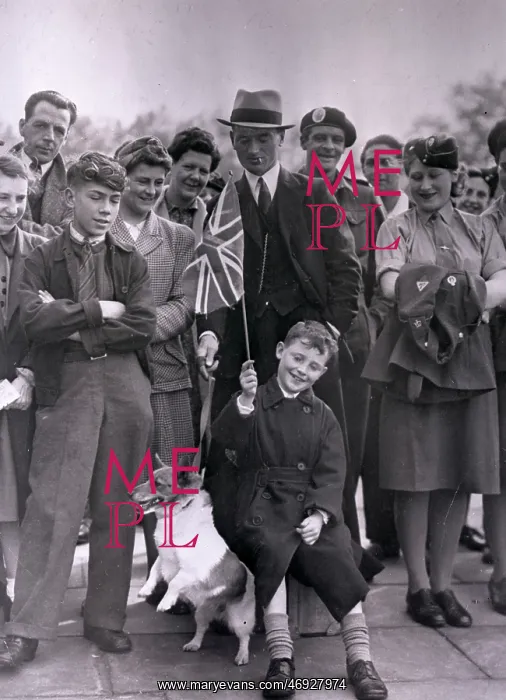 : VE Day. A group of people celebrating VE Day including an excitable terrier : VE Day. A group of people celebrating VE Day including an excitable terrier