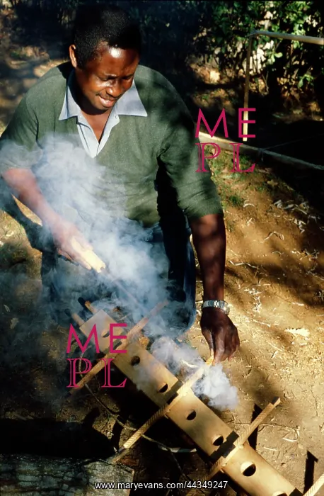  : Venancio Mbande burning holes in key spacers for the
