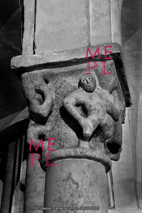  : Verona. Detail of carved figures on the capital of a column in the crypt