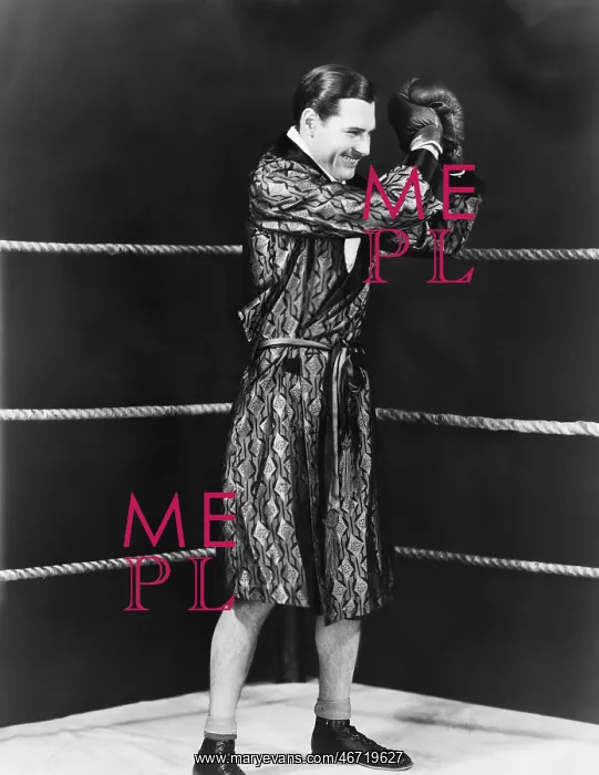 : Victorious boxer in ring : Victorious boxer in ring