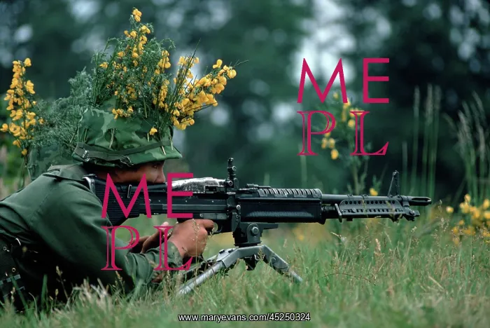 : Vietnam War. A camouflaged infantryman armed with : Vietnam War. A camouflaged infantryman armed with