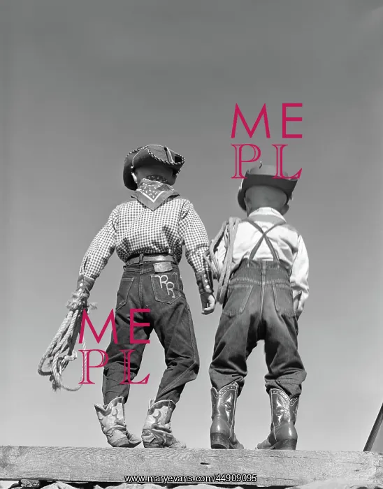  : Back view of two boys dressed in cowboy costume