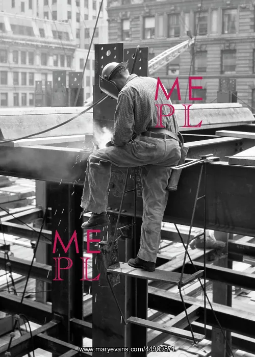 : Side View of Construction Worker Welding on Steel Girder F : Side View of Construction Worker Welding on Steel Girder F