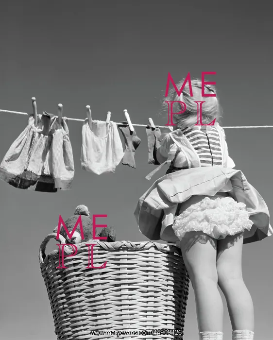 : Back view of girl hanging laundry wind blowing : Back view of girl hanging laundry wind blowing