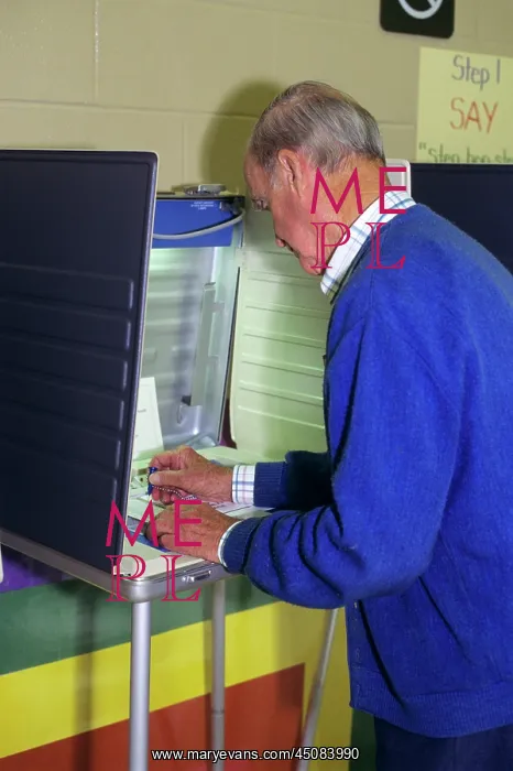 : Side View Older Senior Man Voting in Portable Polling Booth : Side View Older Senior Man Voting in Portable Polling Booth