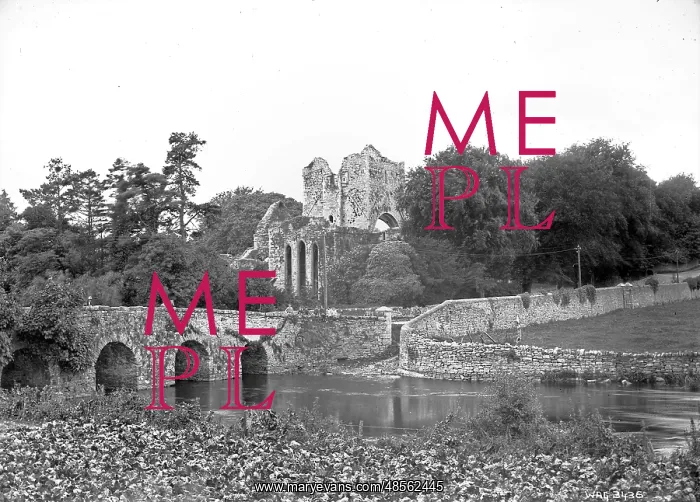 : View of a stone arched bridge and ruined Abbey behind : View of a stone arched bridge and ruined Abbey behind