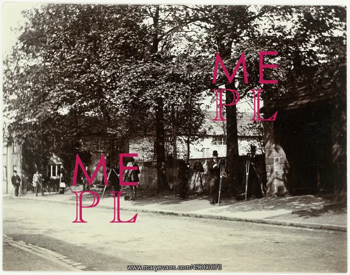 : A view across The Village (street) towards a group : A view across The Village (street) towards a group