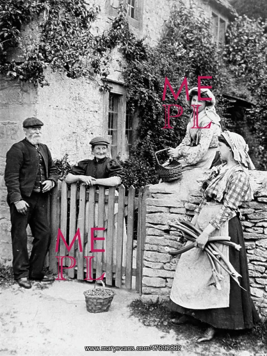 : Villagers chatting over cottage gate, 1890s : Villagers chatting over cottage gate, 1890s
