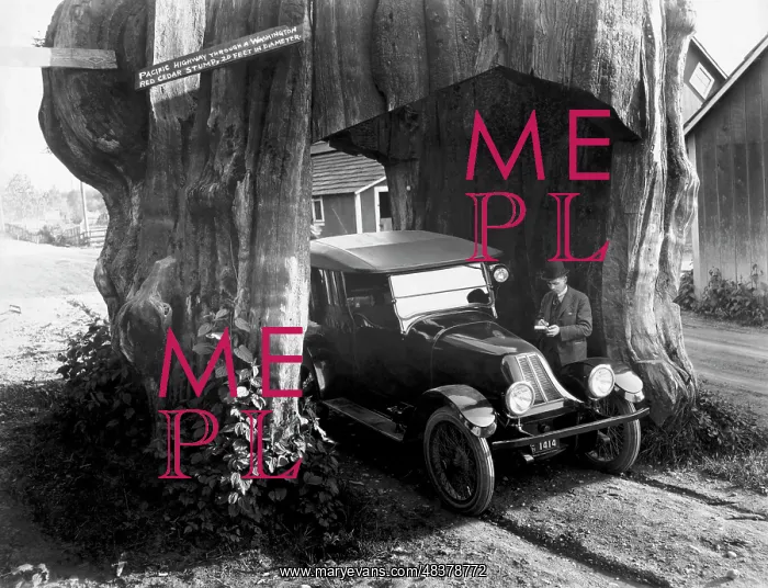 : A vintage automobile parked in the tunnel of a : A vintage automobile parked in the tunnel of a