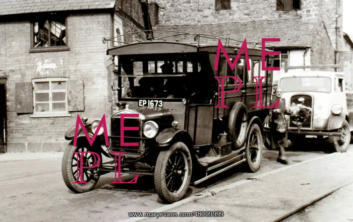 : Vintage vehicle in a yard : Vintage vehicle in a yard