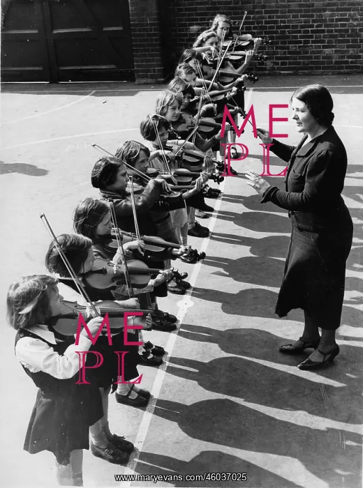 : Violin class in the school playground : Violin class in the school playground