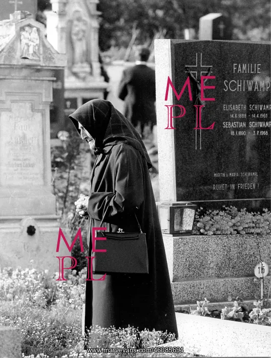 : Visit to the cemetery on All Saints Day. An old : Visit to the cemetery on All Saints Day. An old