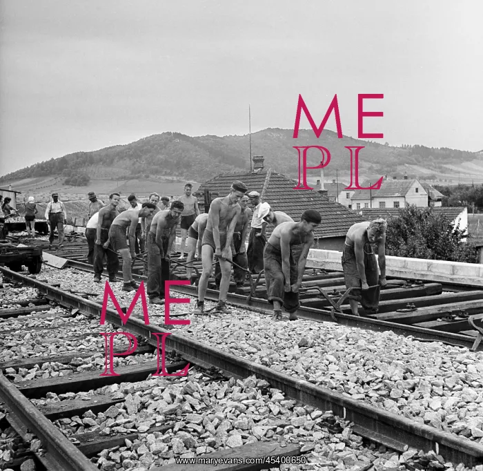 : Volunteers lay rail : Volunteers lay rail