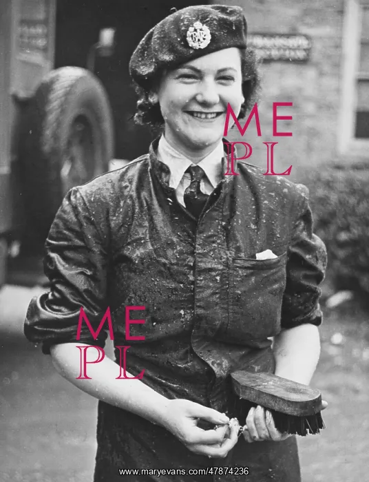  : WAAF WWII. A wet WAAF woman who was cleaning a lorry during World War II