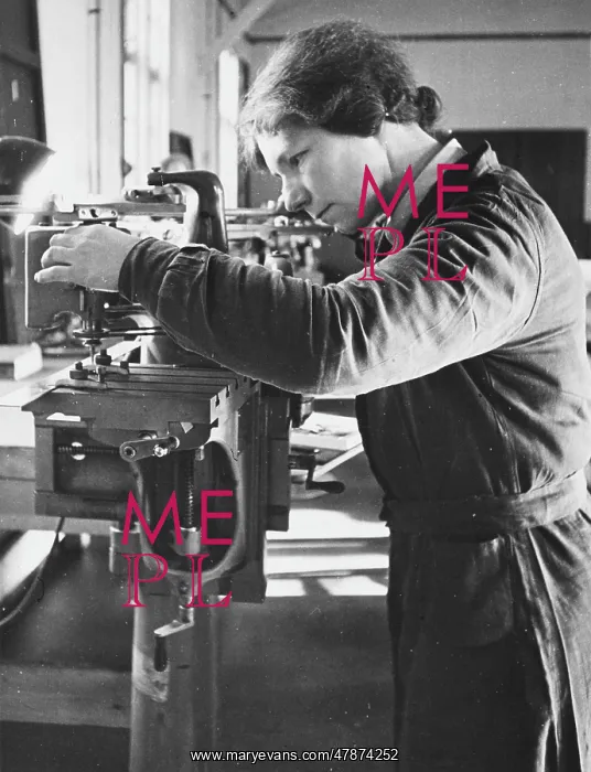  : WAAF WWII. A WAAF working with machinery during World War II