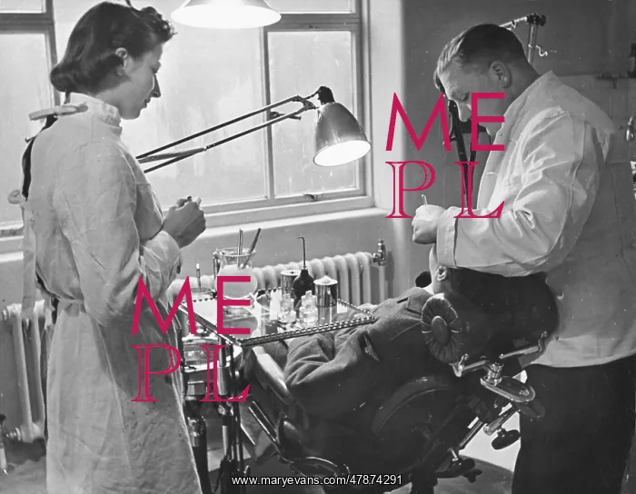  : WAAF WWII. A dentist at an RAF pilot's training college is assisted by