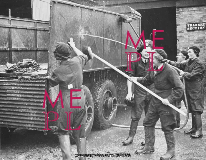  : WAAF WWII. WAAFs washing down an RAF lorry during World War II