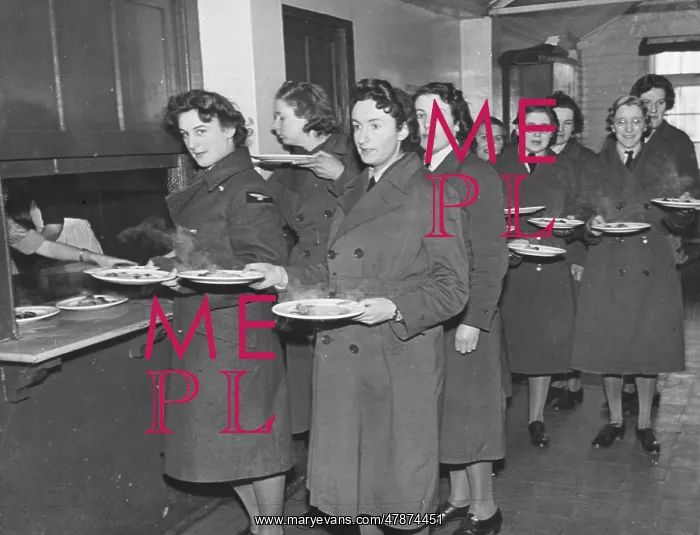  : WAAF WWII. A WAAF lunch queue at lunchtime during World War II