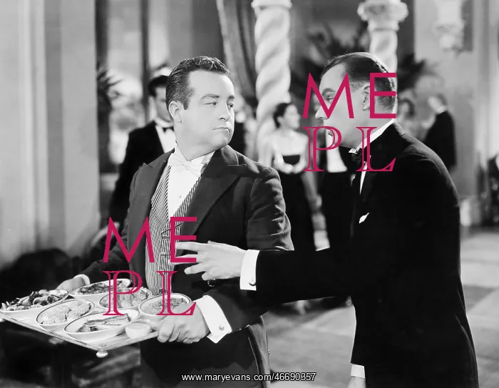 : A waiter and patron at a gala event : A waiter and patron at a gala event