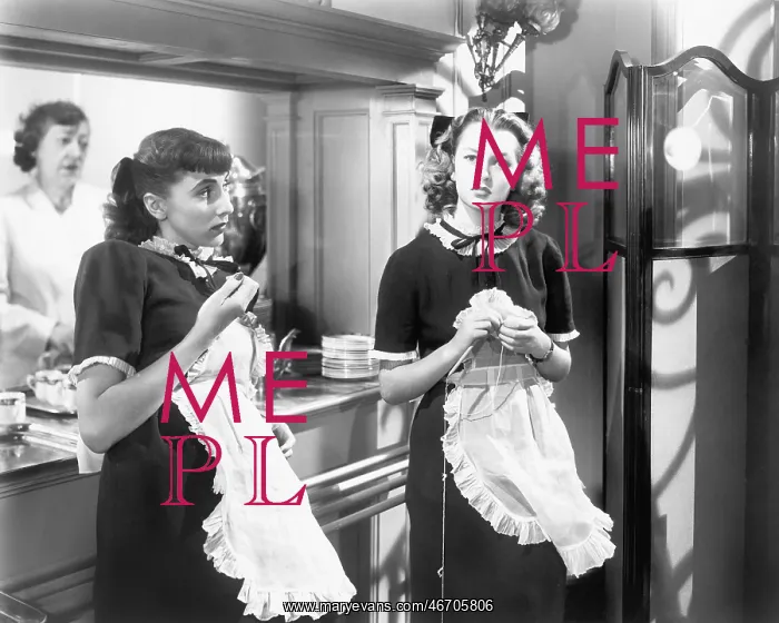 : Two waitresses standing together : Two waitresses standing together
