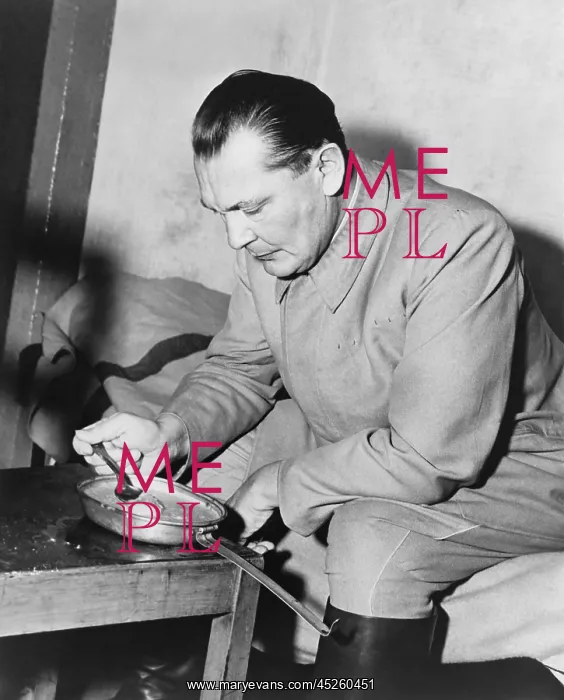 : War criminal Hermann Goering eating gruel from : War criminal Hermann Goering eating gruel from