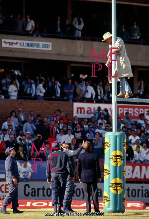 : Watched by amused rugby spectators, members of : Watched by amused rugby spectators, members of