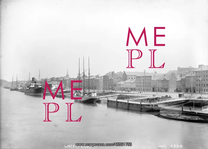 : Waterford - an elevated view along the harbour with boats moored and the buildings behind : Waterford - an elevated view along the harbour with boats moored and the buildings behind