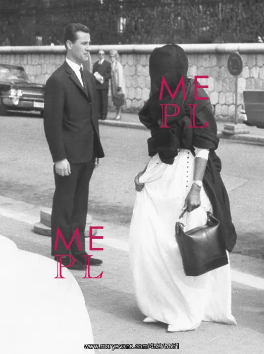 : Wearing a dark veil, one of the wives of King Saud : Wearing a dark veil, one of the wives of King Saud