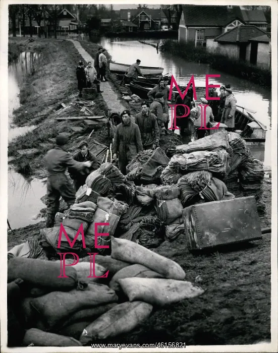 : Weather. Feb. 02, 1953 - R.A.F. Personnel loading Sandbags into boats as : Weather. Feb. 02, 1953 - R.A.F. Personnel loading Sandbags into boats as