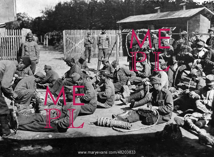 : Weaving straw shoes, 1916 : Weaving straw shoes, 1916