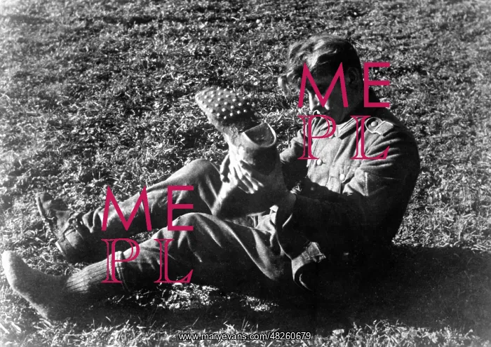 : Wehrmacht soldier empties his boot, 1941 : Wehrmacht soldier empties his boot, 1941