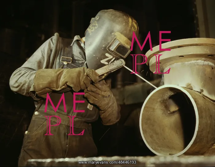 : Welder making boilers for a ship, 1942 : Welder making boilers for a ship, 1942