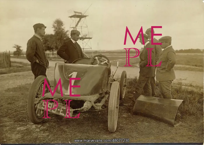 : Wilbur Wright examining the engine of the Delage : Wilbur Wright examining the engine of the Delage