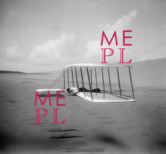 : Wilbur Wright in prone position on glider just after landing : Wilbur Wright in prone position on glider just after landing