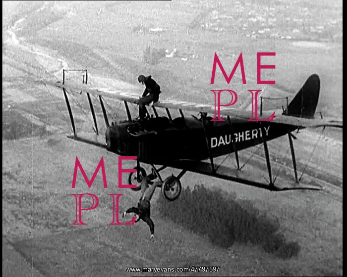 : A Wing Walker Sitting on the Upper Wing Of : A Wing Walker Sitting on the Upper Wing Of