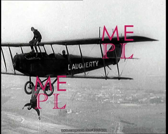 : A Wing Walker Sitting on the Upper Wing Of : A Wing Walker Sitting on the Upper Wing Of