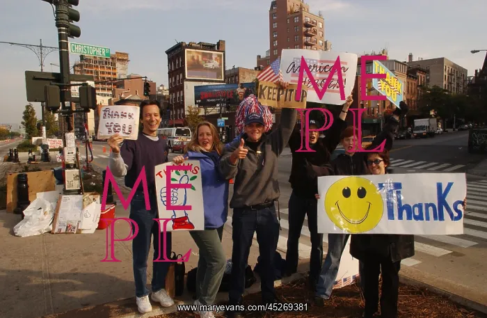: Well wishers near Ground Zero waving at passing : Well wishers near Ground Zero waving at passing