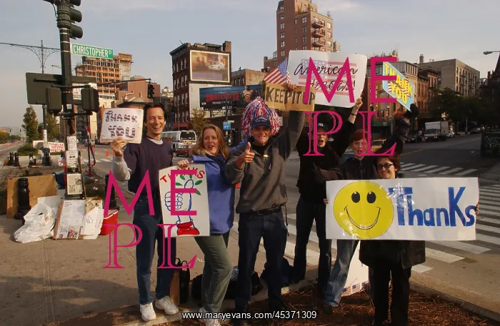 : Well wishers near Ground Zero waving at passing : Well wishers near Ground Zero waving at passing