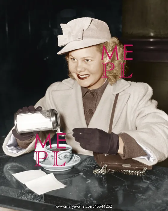 : Woman adding sugar to beverage : Woman adding sugar to beverage