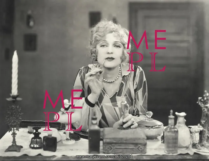 : Woman applying perfume to her lips : Woman applying perfume to her lips