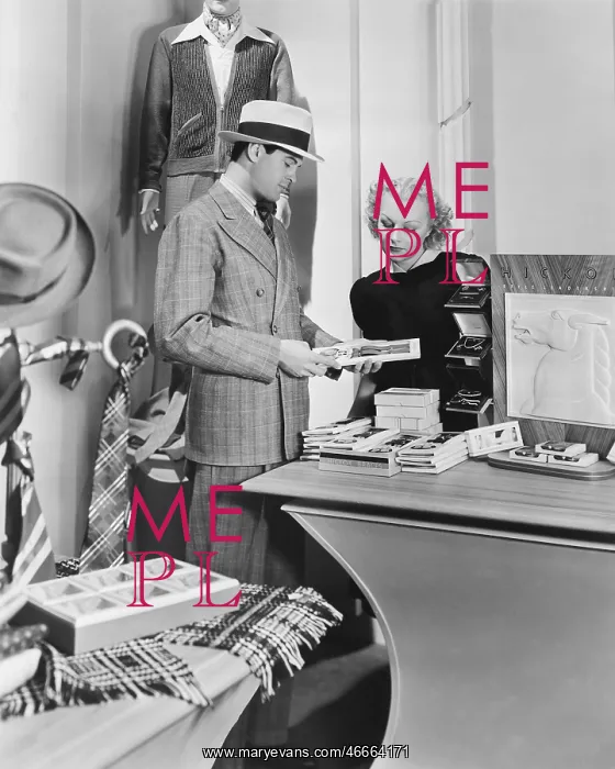 : Woman assisting male customer : Woman assisting male customer