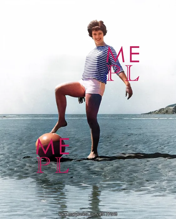  : Woman on beach with ball