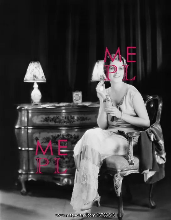  : Woman with bottle of perfume