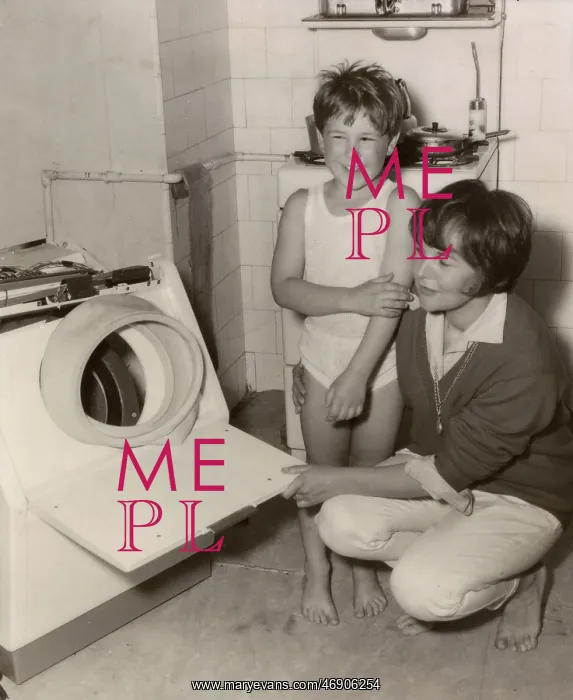 : Woman and boy in a kitchen : Woman and boy in a kitchen