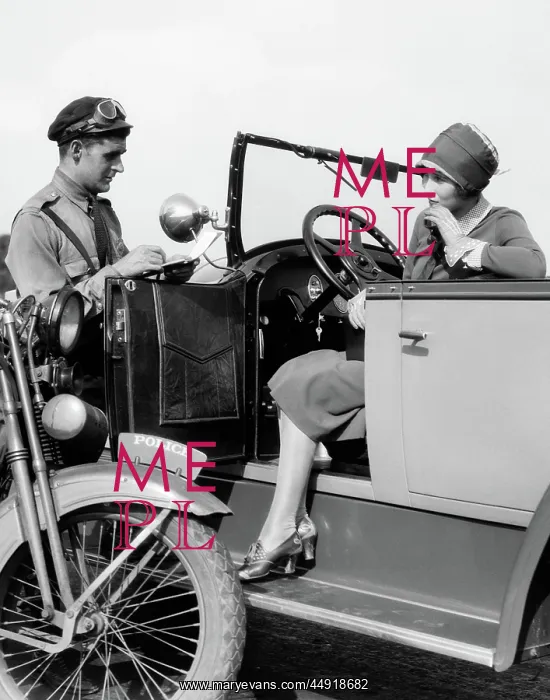 : Woman in car getting ticketed by motorcycle cop : Woman in car getting ticketed by motorcycle cop