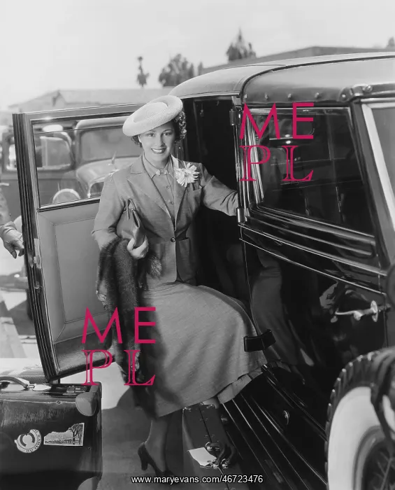  : Woman with car and luggage