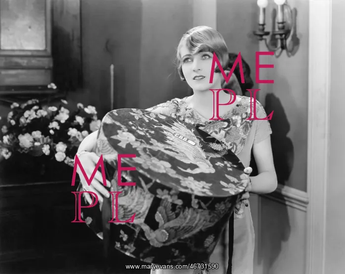 : Woman carrying a big hat box : Woman carrying a big hat box