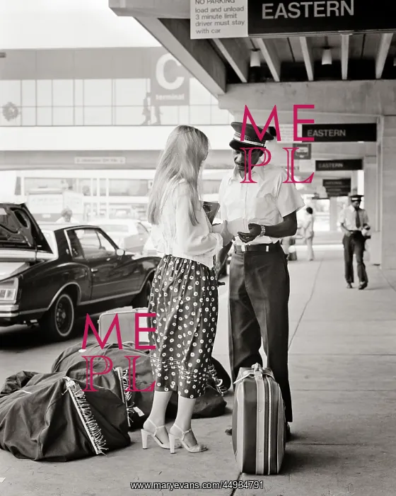 : Woman Checking Bags Curbside : Woman Checking Bags Curbside