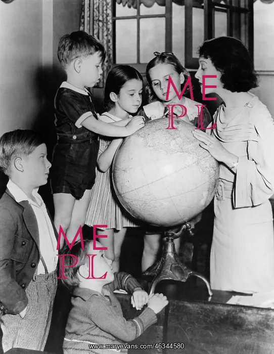 : Woman and children looking at globe : Woman and children looking at globe